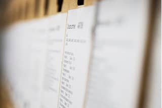 Afbeelding met details van ruggen van archiefdozen